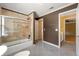 Bathroom with stand-up shower, bathtub, and double doors at 5309 Ashley Trce, Atlanta, GA 30360