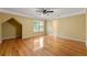 Bedroom with ceiling fan, wood floors, natural light, and en-suite bathroom at 5309 Ashley Trce, Atlanta, GA 30360
