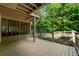This covered deck offers a relaxing space with a view of the yard and landscaping at 5309 Ashley Trce, Atlanta, GA 30360