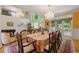 Formal dining room with soaring ceilings, natural light, chandelier, and seating for 12+ guests at 5309 Ashley Trce, Atlanta, GA 30360