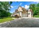 Spacious home with a large driveway and a three car garage at 5309 Ashley Trce, Atlanta, GA 30360