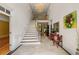 Grand foyer with a chandelier, staircase, and travertine flooring at 5309 Ashley Trce, Atlanta, GA 30360