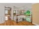 Beautiful foyer with hardwood floors, elegant chandelier, detailed trim work, and arch window at 5309 Ashley Trce, Atlanta, GA 30360