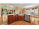 Kitchen island featuring wood cabinets, granite countertops, and a stainless steel dishwasher at 5309 Ashley Trce, Atlanta, GA 30360