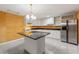 This kitchen includes stainless steel appliances, a center island, and lots of cabinet space at 5309 Ashley Trce, Atlanta, GA 30360