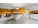 This kitchen features a center island and white appliances and cabinetry at 5309 Ashley Trce, Atlanta, GA 30360