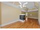 Inviting living room with hardwood floors, fireplace, trey ceiling, and doorway to the adjoining bathroom at 5309 Ashley Trce, Atlanta, GA 30360