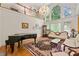 Bright living room with two-story windows, hardwood floors, elegant furnishings and chandelier at 5309 Ashley Trce, Atlanta, GA 30360