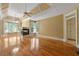 Bright living room featuring hardwood floors, a fireplace, and tray ceiling for a touch of elegance at 5309 Ashley Trce, Atlanta, GA 30360