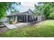 Expansive backyard featuring a covered patio and lush green lawn at 5697 Brooklyn Ln, Norcross, GA 30093