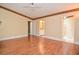 Spacious bedroom with wood flooring, a ceiling fan and attached bath and walk-in closet at 5697 Brooklyn Ln, Norcross, GA 30093