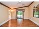 Spacious bedroom with wood floors, ceiling fan and access to the patio and a bathroom at 5697 Brooklyn Ln, Norcross, GA 30093