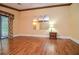 Spacious bedroom featuring wood floors, sliding glass door, and unique decorative details at 5697 Brooklyn Ln, Norcross, GA 30093
