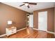 Bedroom boasts gleaming hardwood floors, neutral wall colors, with attached ensuite bathroom at 5697 Brooklyn Ln, Norcross, GA 30093