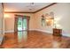 Large bedroom with beautiful wood floors, ceiling fan, large windows and access to covered patio at 5697 Brooklyn Ln, Norcross, GA 30093