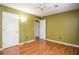 Bright bedroom with wood floors, crisp white trim, and ample closet space at 5697 Brooklyn Ln, Norcross, GA 30093