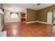 Open concept dining area featuring hardwood floors and modern lighting fixtures at 5697 Brooklyn Ln, Norcross, GA 30093