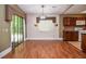 Dining area adjacent to kitchen with hardwood floors and exterior access at 5697 Brooklyn Ln, Norcross, GA 30093