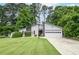 Charming single-Gathering home with lush front lawn and attached two-car garage at 5697 Brooklyn Ln, Norcross, GA 30093