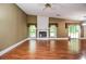 Living room featuring fireplace, hardwood floors, and natural lighting at 5697 Brooklyn Ln, Norcross, GA 30093