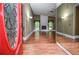 Open living room with hardwood floors, stone fireplace, and lots of natural light at 5697 Brooklyn Ln, Norcross, GA 30093