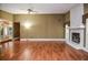 Open concept living room boasting hardwood floors and a stone fireplace at 5697 Brooklyn Ln, Norcross, GA 30093