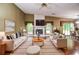 Staged living room featuring bright furniture and modern decor elements at 5697 Brooklyn Ln, Norcross, GA 30093