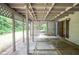 Covered patio with decorative lattice and concrete flooring transitions to backyard at 5697 Brooklyn Ln, Norcross, GA 30093