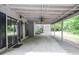 This covered patio has a ceiling fan, lots of open space and is perfect for outdoor relaxing and entertaining at 5697 Brooklyn Ln, Norcross, GA 30093