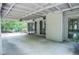 Spacious covered patio with stained concrete flooring extends to backyard at 5697 Brooklyn Ln, Norcross, GA 30093