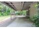 Enjoy outdoor living on this covered patio with ample space and views of the landscaped yard at 5697 Brooklyn Ln, Norcross, GA 30093