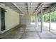 Covered patio area with concrete flooring transitions to backyard at 5697 Brooklyn Ln, Norcross, GA 30093
