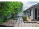 Landscaped side yard featuring a stone path, white picket fence, and lush greenery at 5697 Brooklyn Ln, Norcross, GA 30093