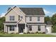 New two-story home with grey brick exterior, grey roof, and well manicured lawn at 611 Villa Rica Spgs, Villa Rica, GA 30180