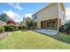 Well-manicured backyard featuring lush green grass and landscaping at 8360 Village School Dr, Cumming, GA 30041