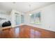 Bright dining area with hardwood flooring and a view to the exterior at 8360 Village School Dr, Cumming, GA 30041