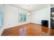 Cozy dining area featuring gleaming hardwood floors and abundant natural light at 8360 Village School Dr, Cumming, GA 30041