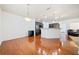 Charming dining area adjoining the kitchen and living spaces with hardwood floors at 8360 Village School Dr, Cumming, GA 30041