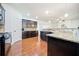 Gourmet kitchen featuring granite countertops, custom cabinetry, and modern appliances at 8360 Village School Dr, Cumming, GA 30041