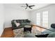 Comfortable living room features stylish furnishings, area rug, and plenty of natural light at 8360 Village School Dr, Cumming, GA 30041