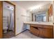 Bathroom with toilet, sink, vanity mirror, and tub at 2485 Shady Shoals Ct, Decatur, GA 30034
