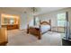 A Primary bedroom with bed, bathroom, and windows at 2485 Shady Shoals Ct, Decatur, GA 30034