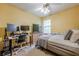 Bedroom with a bed, a desk, and two computer monitors, illuminated by a ceiling fan at 2485 Shady Shoals Ct, Decatur, GA 30034