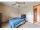 Modest bedroom featuring a ceiling fan and a TV for entertainment at 2485 Shady Shoals Ct, Decatur, GA 30034