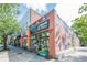Charming brick boutique with vibrant mural and storefront display at 2485 Shady Shoals Ct, Decatur, GA 30034