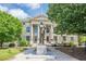 View of a historic courthouse with statue, columns, and green lawn at 2485 Shady Shoals Ct, Decatur, GA 30034