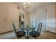 Bright dining area showcases a modern glass table and a view to the kitchen at 2485 Shady Shoals Ct, Decatur, GA 30034