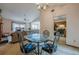 Bright dining area showcases a modern glass table and seamlessly connects to the living room at 2485 Shady Shoals Ct, Decatur, GA 30034