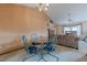 Bright dining area showcases a modern glass table and seamlessly connects to the living room at 2485 Shady Shoals Ct, Decatur, GA 30034