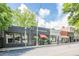 View of storefronts including a brick building and restaurant with outdoor seating on sidewalk at 2485 Shady Shoals Ct, Decatur, GA 30034